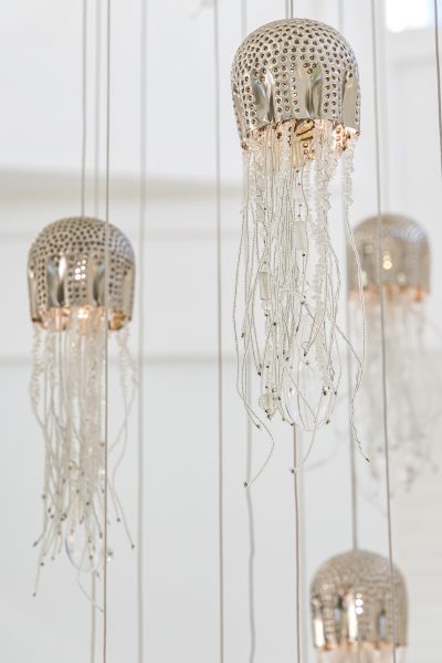 Chandelier details at Lighthouse Pointe, a D'Asign Source design-build