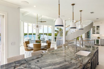 Kitchen and dining at Lighthouse Pointe, a D'Asign Source design-build