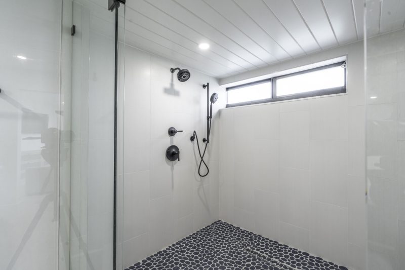 Primary bathroom at Marthaler, a condo renovation project by D'Asign Source