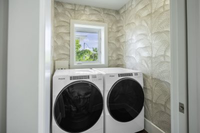 Laundry area at Sapphire & Mahogany, a remodel project of D'Asign Source.